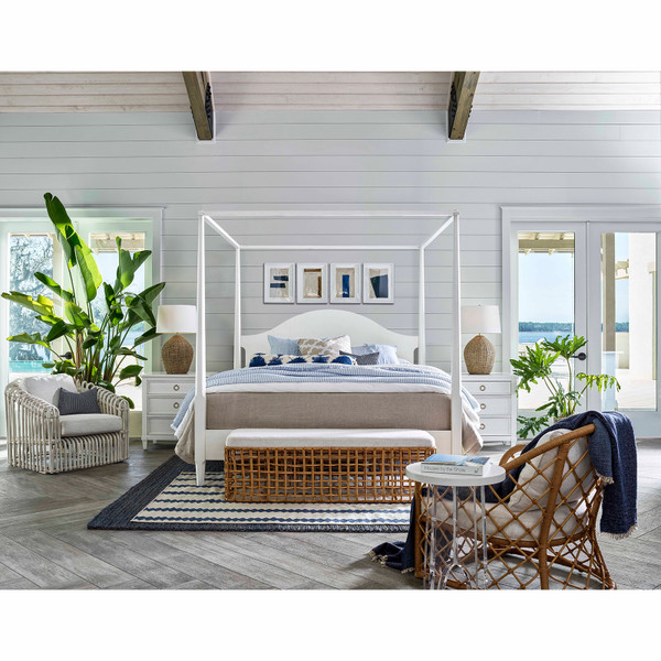 Coastal styled bedroom with a wicker bench